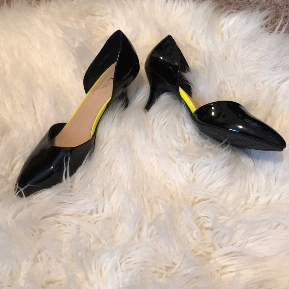 Black 3” heels w/ yellow lining. Size 91/2.